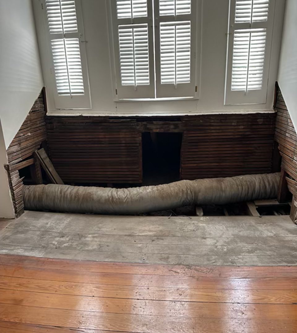 Large tube in hole in wall