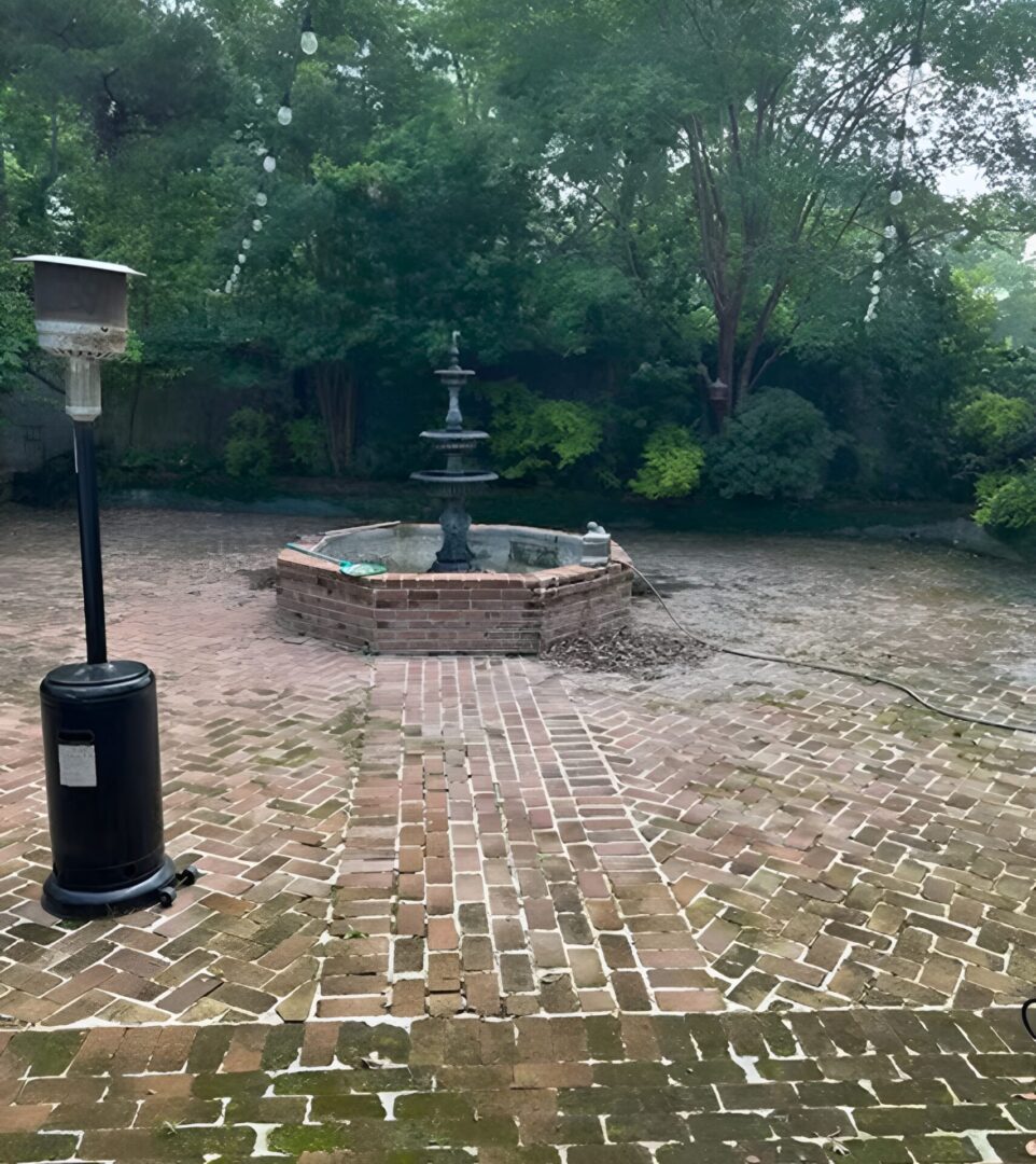 Garden patio featuring a classic water fountain
