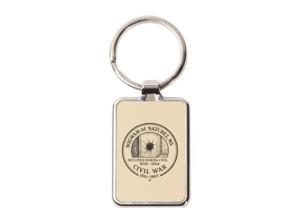 Rectangular keychain with a circular emblem and text.