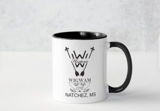 Black and white coffee mug with Native American-inspired design and text.
